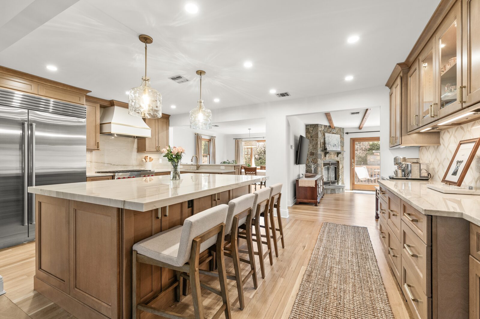 Renovated kitchen with custom cabinetry, view 005
