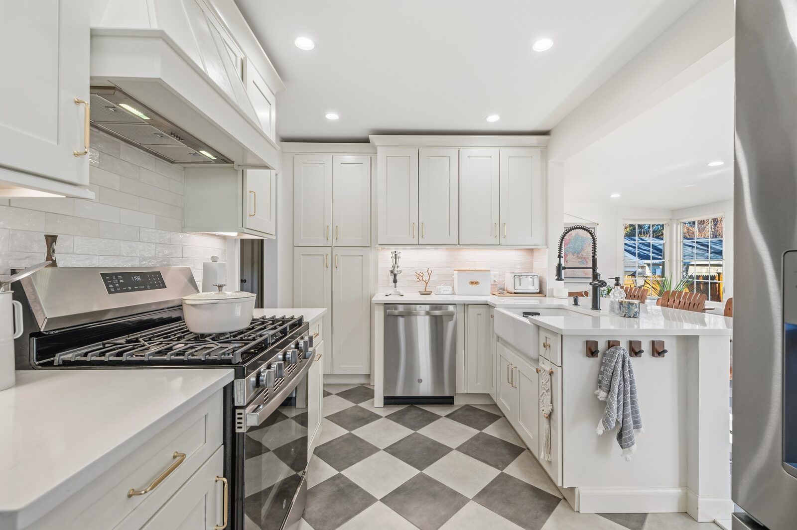 Renovated kitchen with custom cabinetry, view 007