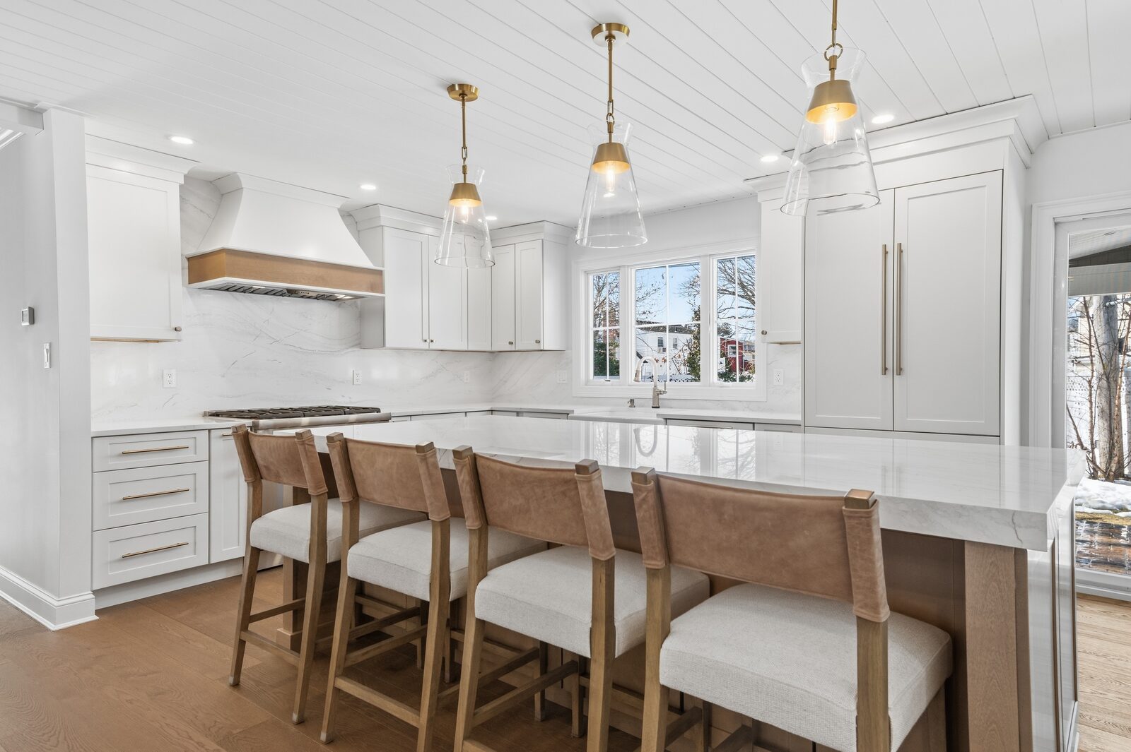 Renovated kitchen with custom cabinetry, view 009
