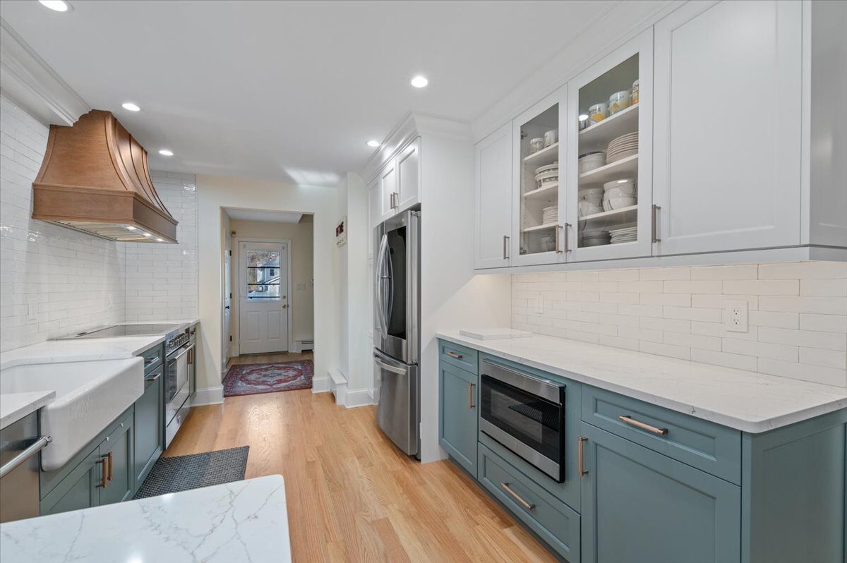 Renovated kitchen with custom cabinetry, view 053
