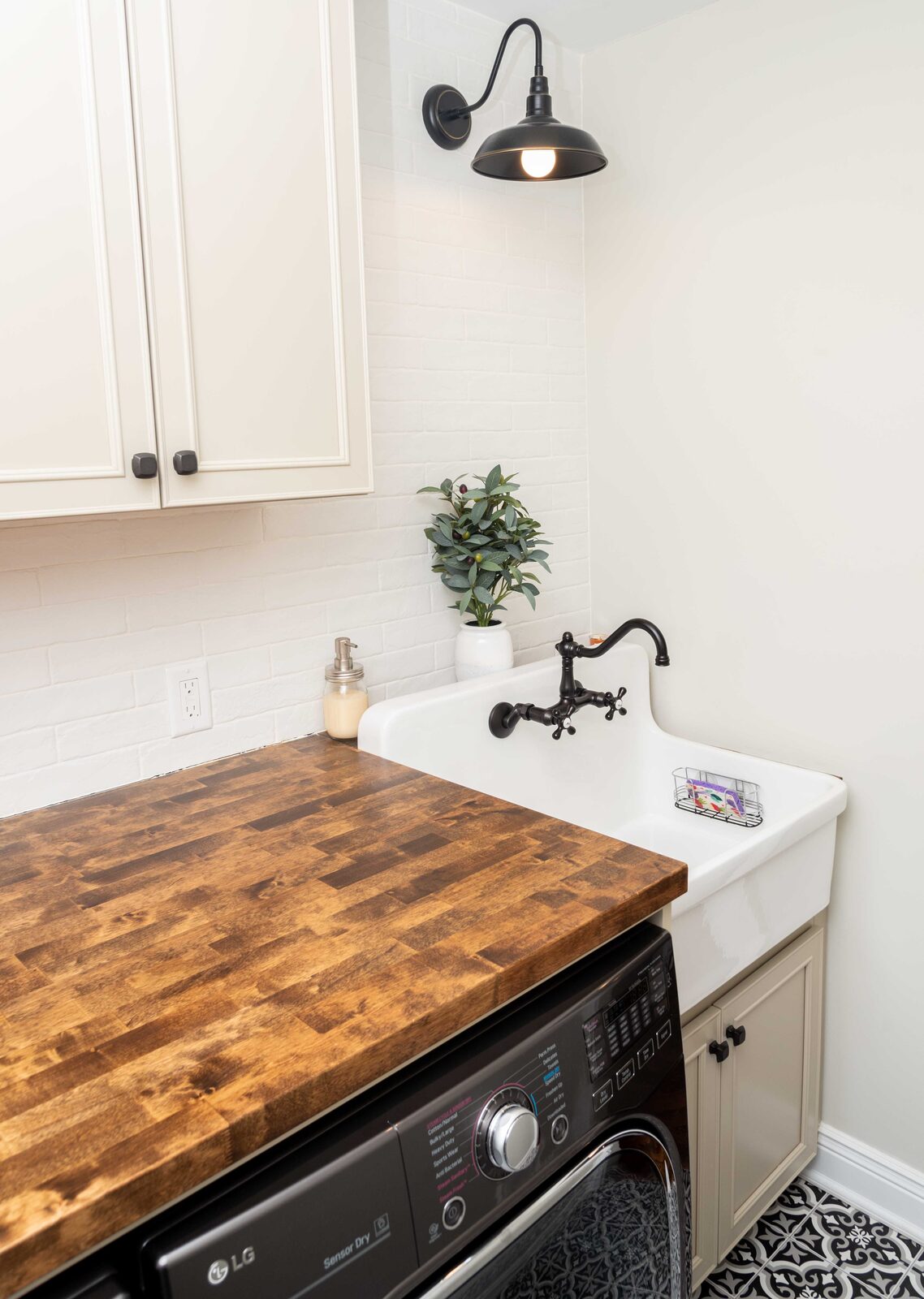 Laundry sink with a wood countertop